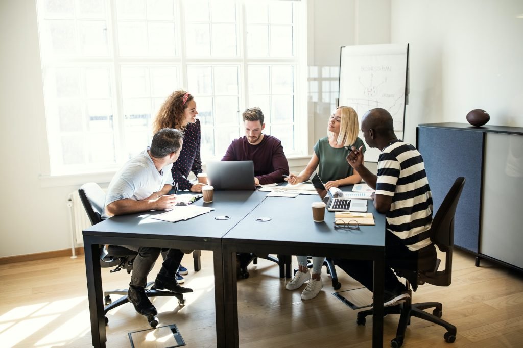 people working on a project together in an office-eves cleaning utah