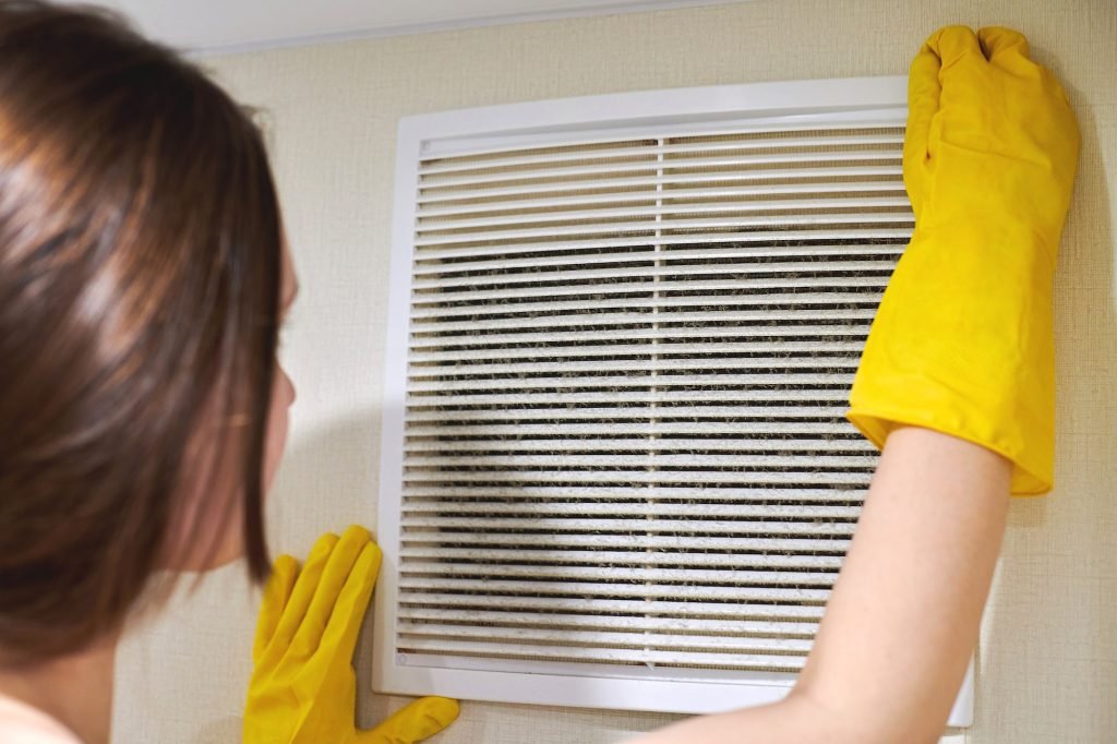 cleaning ventilation grill of HVAC -house cleaning services utah - eves