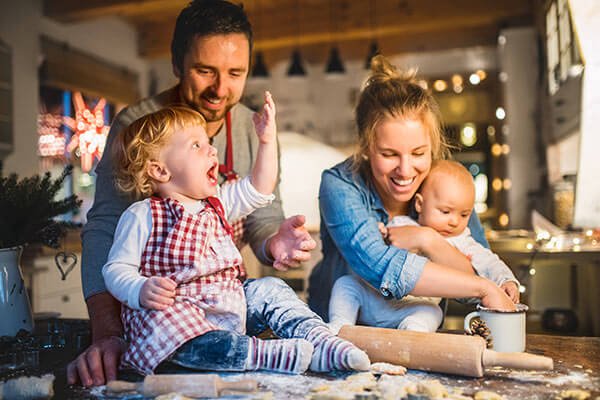 happy family at the kitchen cooking together-eves cleaning utah